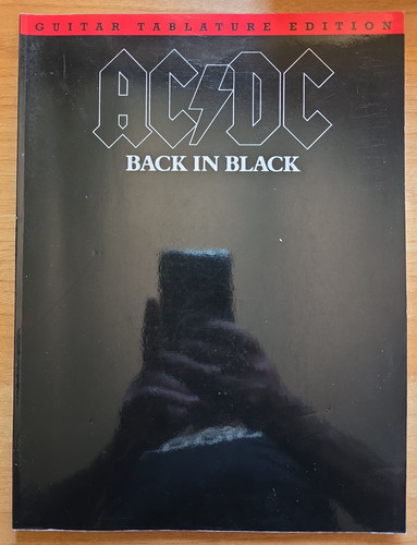 Back black guitar - in,